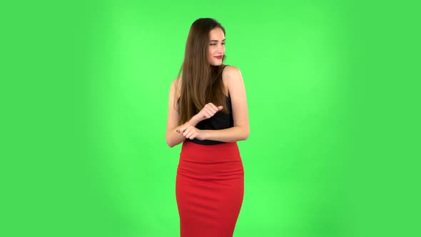 Girl Is Dancing on a Green Screen in the Studio