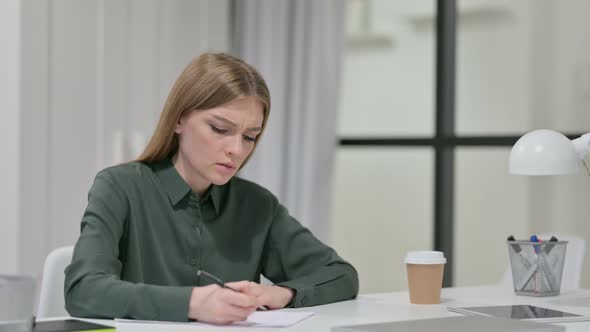 Young Woman Unable To Write on Paper, Failure 