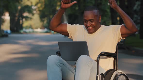 Mature Adult Paralyzed African American Man Using Laptop Received Good News Email Job Offer or