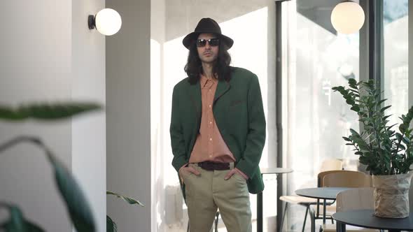 Young Confident Retro Man Posing in Coffee Bar Indoors