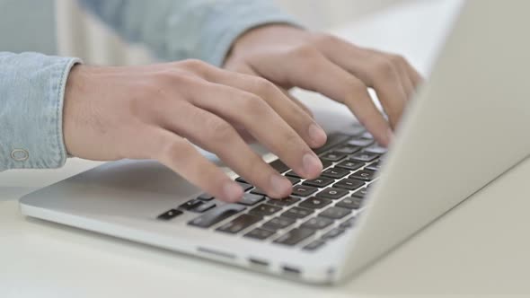 Close Up of Hands Typing on Laptop