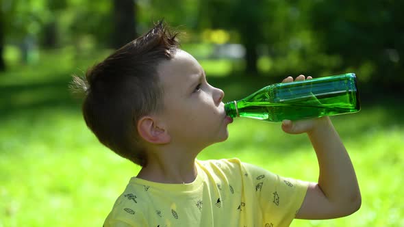 Boy Drinking Water From A Bottle