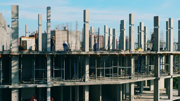 Many Contractors Work at a Building Site. Timelapse.