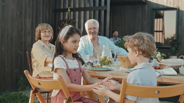 Grandparents Watching Kids Playing