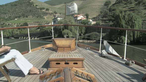 Mature woman reading book on a boat