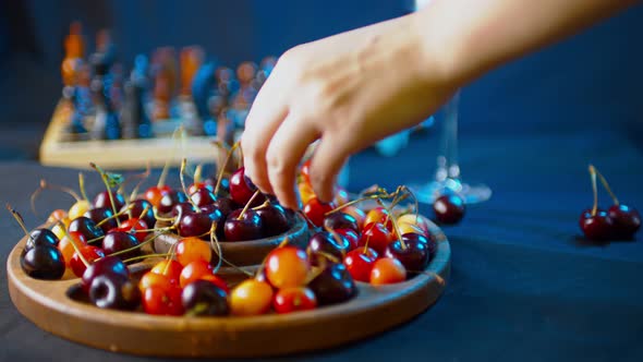 Close Up of Compartmental Dish with Different Varieties of Sweet Cherries on Table