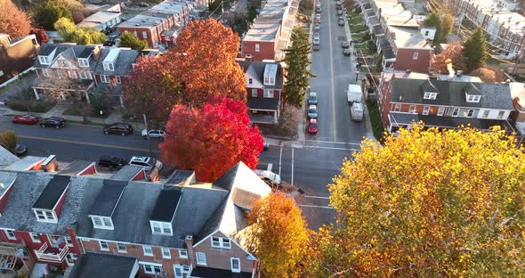 Beautiful light during morning sunrise. Aerial establishing shot of homes in urban city. Triangle la