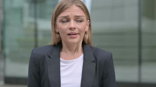 Young Businesswoman Shaking Head As No Sign Denial Outdoor