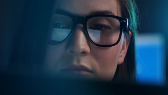 Close Up of Tired Woman Working at Night on Laptop Girl in Eye Glasses with Reflections Overworking