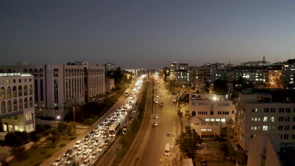 Jerusalem crossroad one way traffic jam, night, Israel, aerial shot with drone