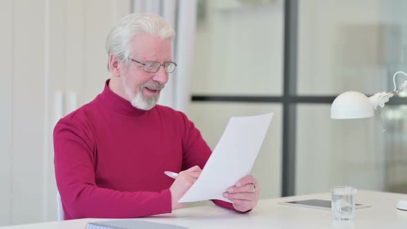 Old Man Celebrating After Reading Documents