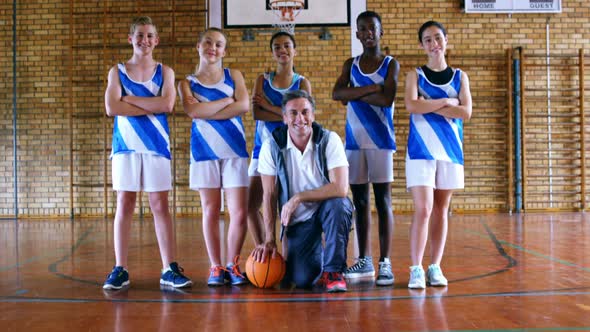 Portrait of coach and schoolkids with basketball 4k