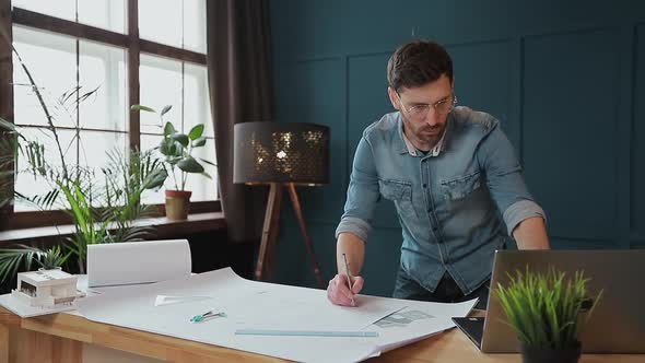 Architect Working on Blueprint with Spesial Tools and Pencil, Close Up. Male Architect at Work, Only