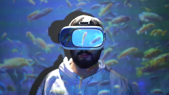 concept of virtual tour with vr glasses. person wearing vr glasses with aquarium projection