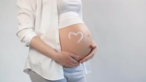 Happy Pregnant Woman Dressed in Comfort Home Suit