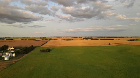 Drone flying by a family operated grain farm in rural Alberta. Incredibly vast and remote prairie la