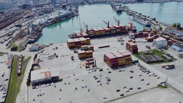 Aerial top view of cargo ship standing in the port