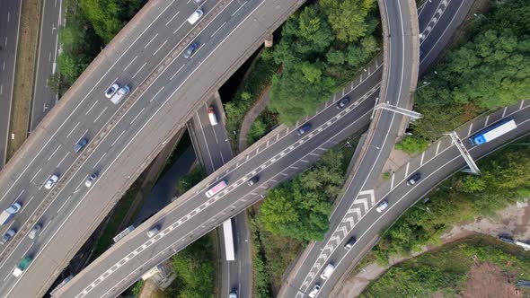 Vehicles Driving on a Spaghetti Interchange Bird's Eye Aerial View