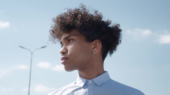 Portrait of Black Man Very Happy Smiling Over Sky Background