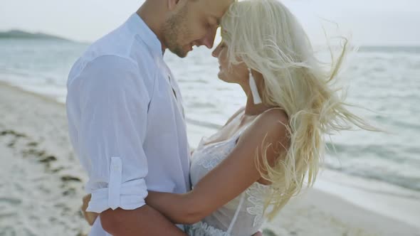 Happy Couple Embracing on Seashore