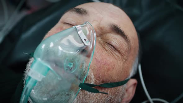 Aged Man in Oxygen Mask