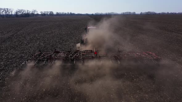 Ploughing Tractor at Field Cultivation Work Aerial View