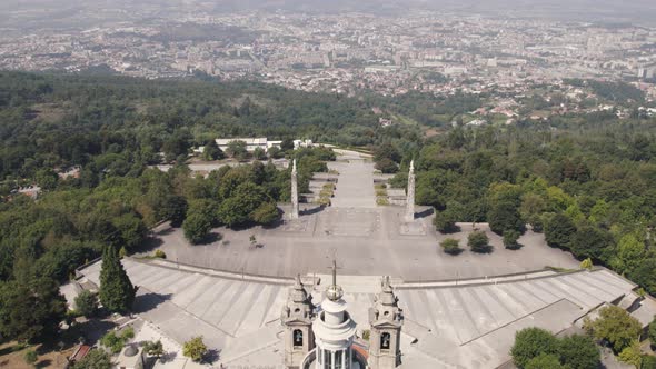 Stairways and Sameiro Sanctuary, Braga, Portugal, against cityscape.  Establishing shot