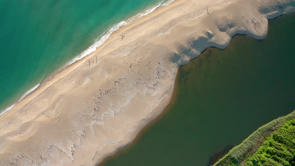 Exotic sandy beach surrounded by sea and river