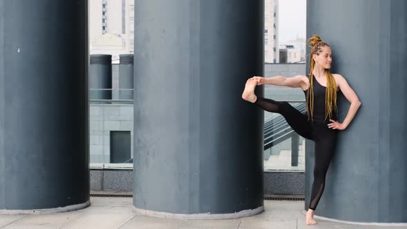 Fitness Woman Stretching Outdoots at Urban Spaces