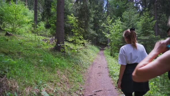 Hikers Walking In The Woodland Within Slovak Carpathian Mountains In Liptov, Europe. POV Shot