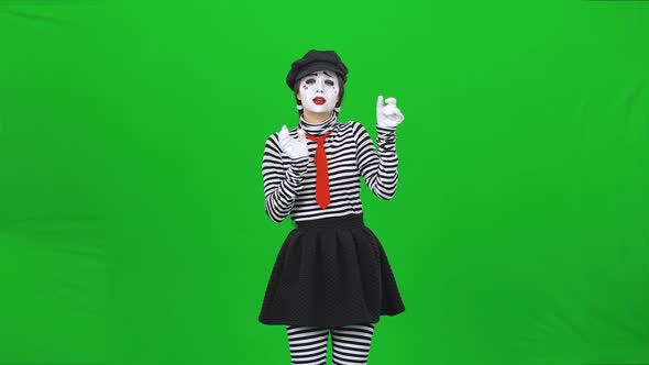 Mime Girl Listening To the Music Through Headphones