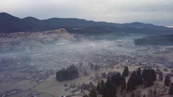 Flight Over the Village in the Carpathian Mountains