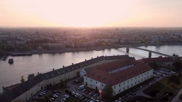 Aerial view of Petrovaradin fortress, Danube river and Novi Sad skyline during sunset