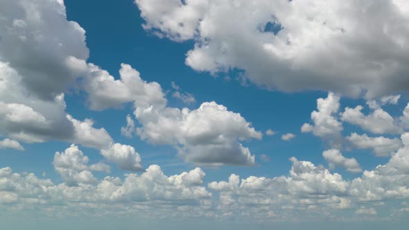 Timelapse of White Puffy Cumulus Clouds Forming on Summer Blue Sky