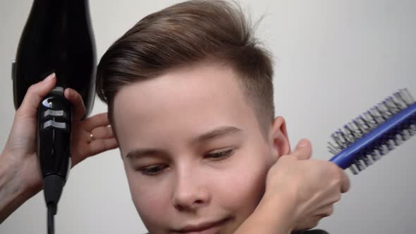 Male blow-dry with a bomber brush close-up.