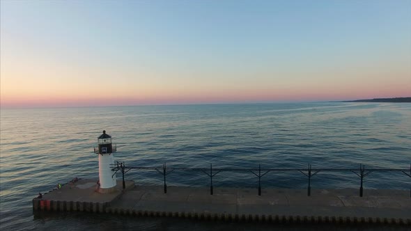 Aerial shot pans across Lake Michigan at sunset