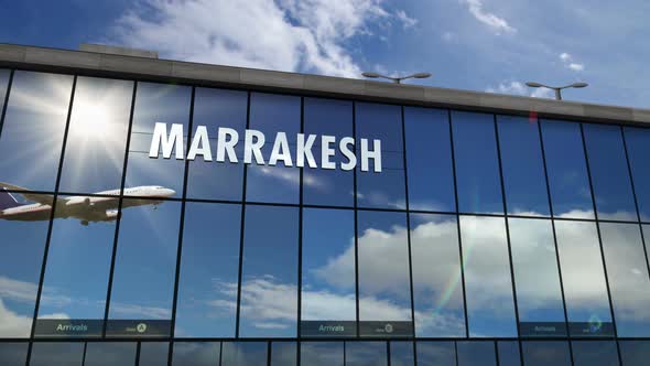 Airplane landing at Marrakesh, Marrakech Morocco airport mirrored in terminal