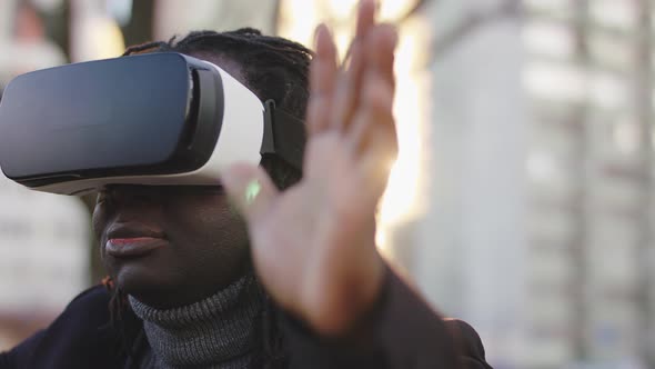 African American Black Man Wearing VR Headset in the Park