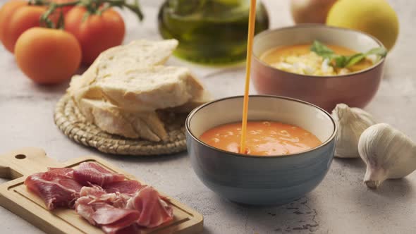 Serving salmorejo in a bowl, with various ingredients