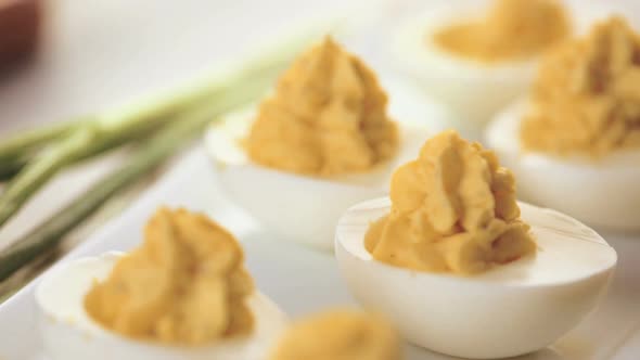 Time lapse. Preparing deviled eggs with organic eggs for appetizer. Step by step recipe.