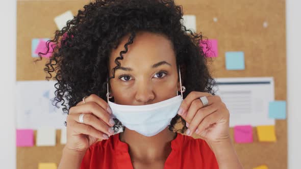 Portrait of woman wearing face mask at office