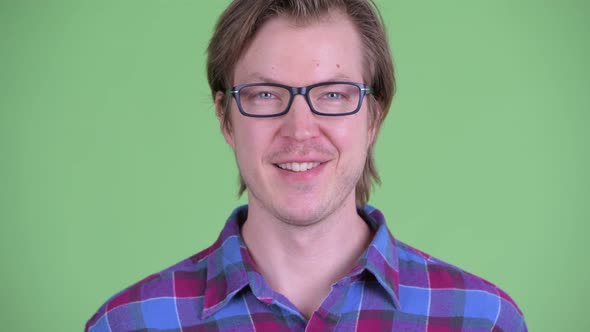 Face of Happy Young Handsome Hipster Man Smiling