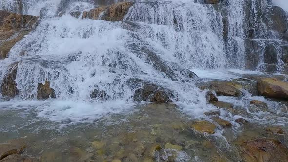 Granite Creek Falls flowing in slow motion tilting up to the sky