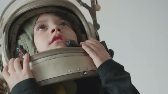 Little Cosmonaut Girl Looking Up