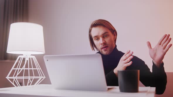 Young Caucasian Teacher Having Online Class From His Home