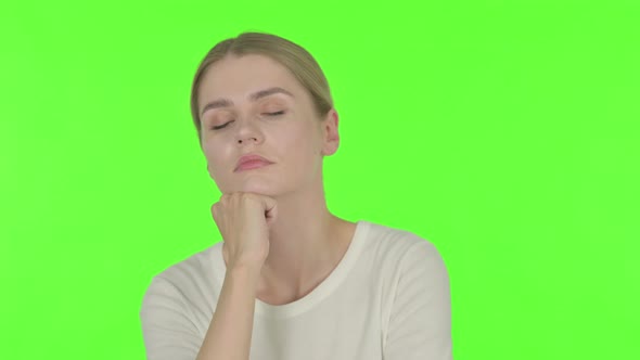 Young Woman Coughing on Green Background