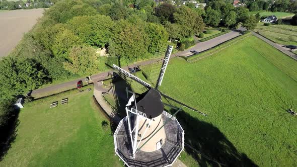 Flyover aerial footage of windmill.