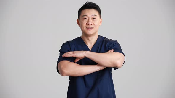 Smiling Asian doctor looking at the camera