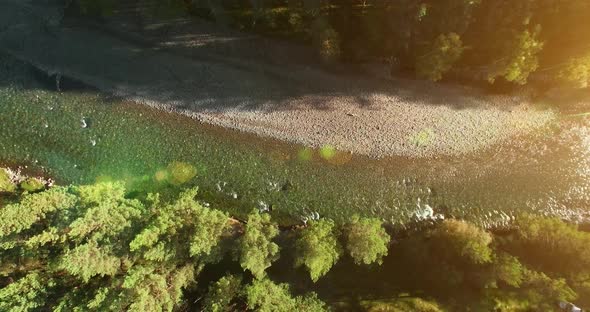 Mid Air Flight Over Fresh and Clean Mountain River at Sunny Summer Morning. Vertical Movement