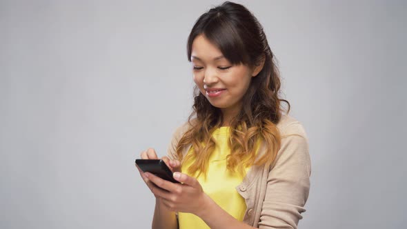 Asian Woman Using Smartphone